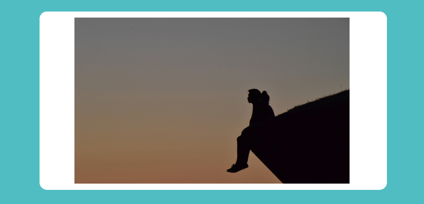 struggling. So, a woman is sitting at the edge of cliff